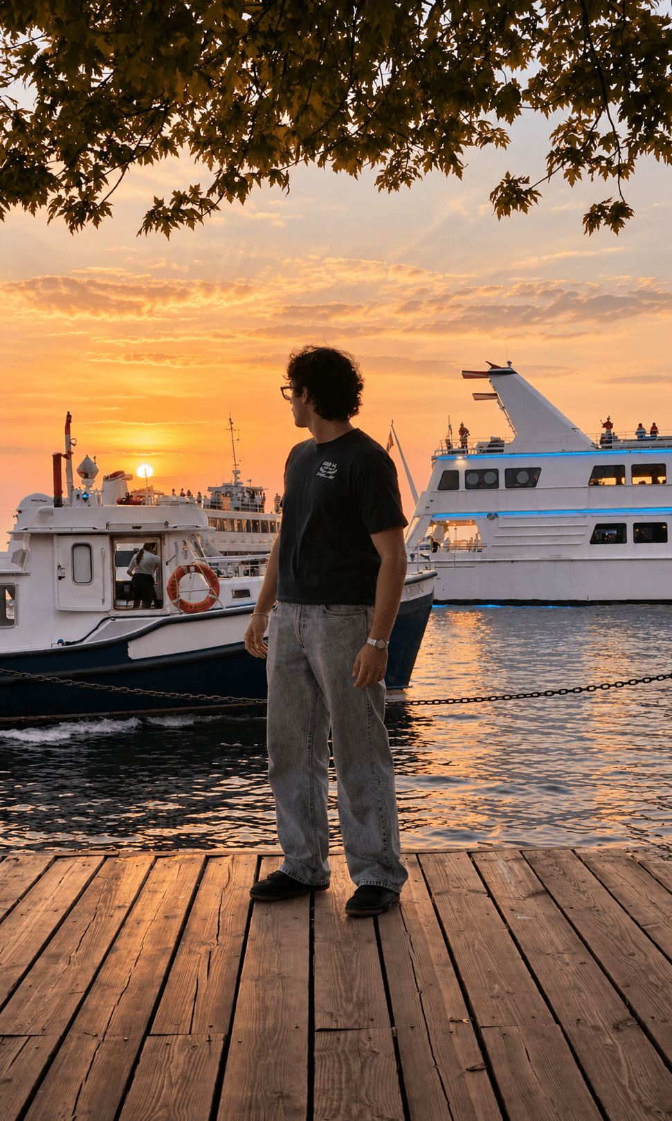 Black Celura tee styled by the waterfront at sunset